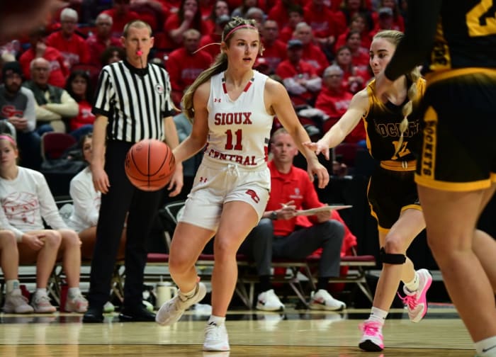 Sioux Central's Hadley Ayers dribbles up the court against Eddyville-Blakesburg-Fremont during a Class 2A state quarterfinal at Wells Fargo Arena in Des Moines on Tuesday. (Photo by Ryan Timmerman)